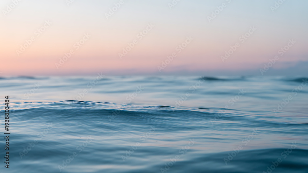 Fototapeta premium Calm ocean waves at twilight with soft pastel sky