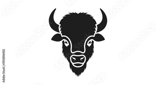 Black bison head with horns facing forward.