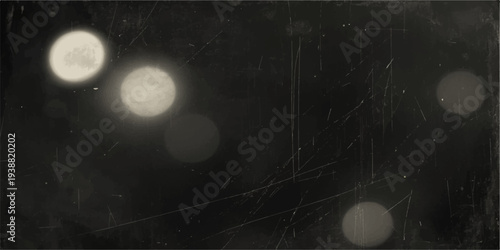 A grunge film strip frames a bright lunar eclipse as the projector lens captures a full moon glowing through dark clouds across the vast black night sky in an abstract space timelapse