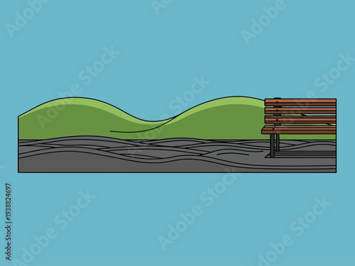 Park bench on a grassy hill with a path.