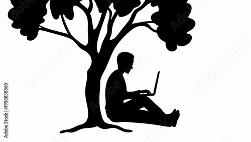 Man sitting under tree working on laptop in nature