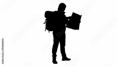 Hiker checking map on adventure