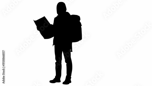 Hiker studying map with backpack on for adventure travel