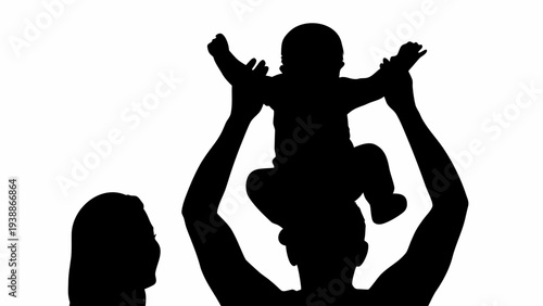 Silhouette of happy family with father holding baby