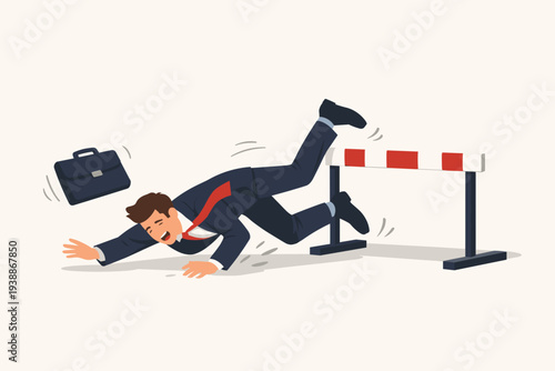 Businessman in a suit falling over a hurdle obstacle, representing business failure, career mistake, difficulty overcoming challenges, professional setback, and underperforming employee at work.