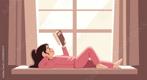 A young girl in pink pajamas peacefully enjoys a quiet moment, comfortably reading an engaging book while lounging on a sunlit window sill at home