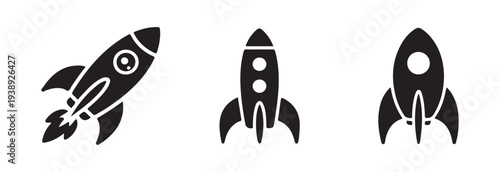 Simple black silhouette of a stylized rocket ship launching upwards with flames