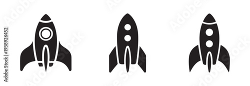 Minimalist black graphic icons depicting rocket ships ready for launch or in mid air trajectory