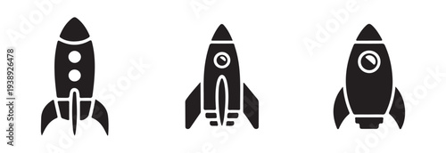 Arrangement of three distinct black vector icons showing stylized rockets ready for space voyage and ignition sequence