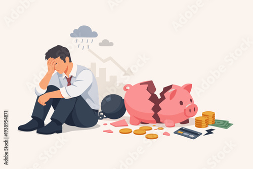 Depressed businessman sitting with broken piggy bank, ball and chain, and falling graph. Concept of financial crisis, debt, bankruptcy, poverty, economic recession, money loss, and unemployment.