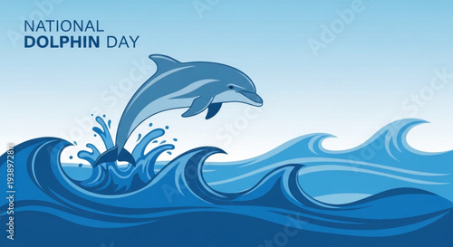 Dolphin jumping out of ocean waves on national dolphin day with a clear blue sky background