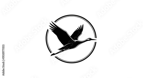 Graceful flying crane bird silhouette inside a circular frame. Minimalist black and white graphic design element for logos and icons.