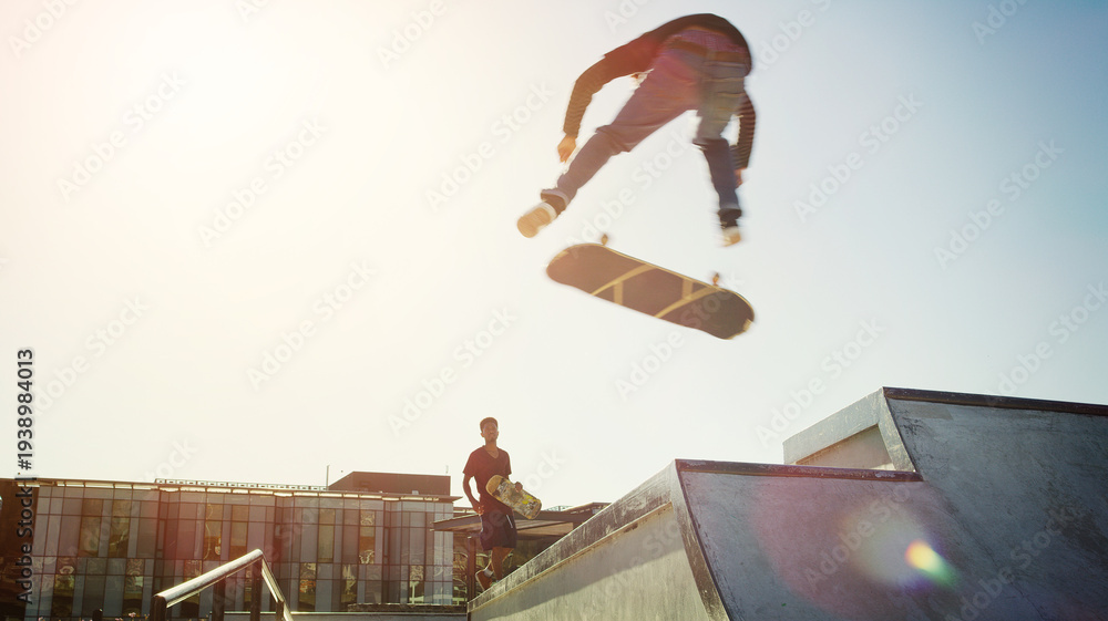 Fototapeta premium Jump, air and man with skateboard for trick, extreme sports or training with action on ramp outdoor. Professional skateboarder, skatepark or person with stunt, exercise or mockup space with low angle