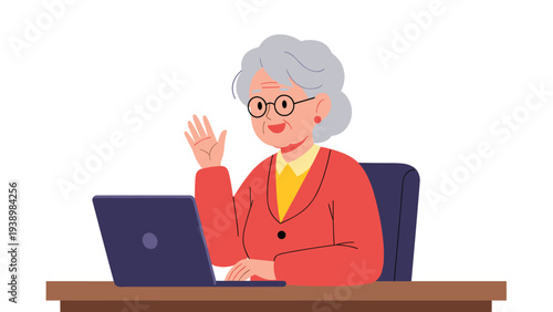 Cheerful senior woman with glasses and gray hair waving during a video call on her laptop computer for technology and aging themes.