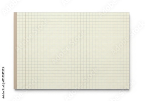 A large notepad with a grid pattern on its paper