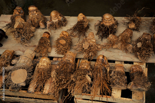 Unique traditional Vietnamese handicrafts for sale in a traditional market in Sapa, Vietnam. It is known as bamboo root sculptures. 
