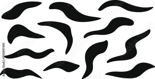 Scattered black abstract organic shapes on transparent background for graphic design.