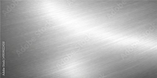 Abstract a close-up, high-definition shot captures the sleek surface of brushed metal. The light dances across the intricate texture, creating a captivating visual effect.