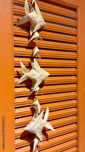 wooden window with origami fish