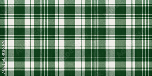 A seamless green plaid fabric texture featuring a classic tartan pattern and checkered textile design for use as a vector wallpaper backdrop or cloth material illustration
