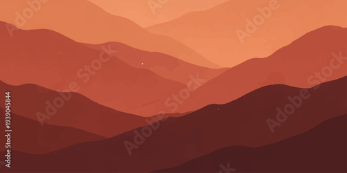 A majestic sunset illuminates the blue mountain range as golden sun light pierces through morning mist and fog over a forest valley with silhouettes of peaks against a dawn horizon