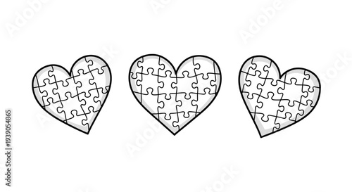 Three heartshaped puzzle pieces connected symbolizing love and unity
