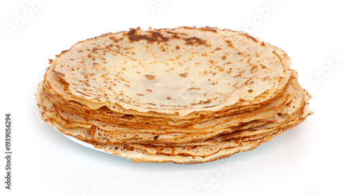 A stack of pancakes on a white plate