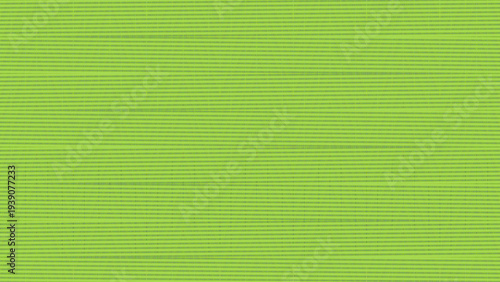 Close-up green textured surface with horizontal woven ribbed lines fabric synthetic material industrial upholstery background