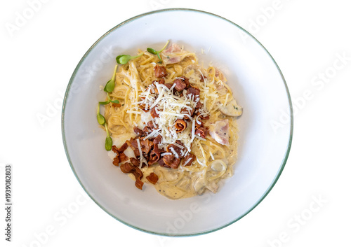 Die cut of Spaghetti carbonara with cheese and crispy bacon on white isolated.