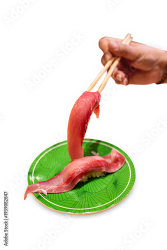 Top view of Fresh Tuna fish or Otoro with chopsticks in the red plate, focus selective