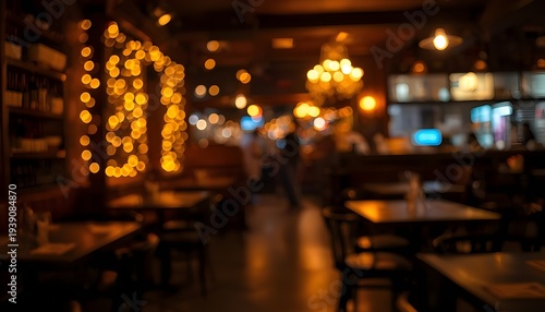 A dimly lit restaurant interior with warm lighting and empty tables
