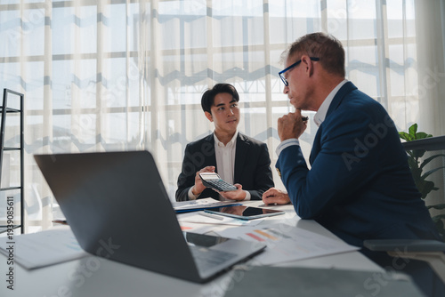 Young financial advisor discussing business plan with client