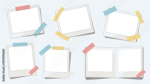 Various blank instant photo frames held with colorful pieces of tape on a light gray background for a creative layout.