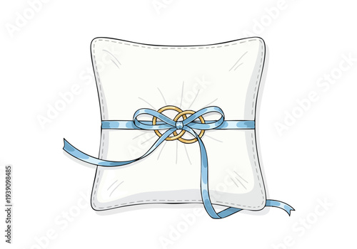 A pristine white ring bearer pillow adorned with two interlocked gold wedding rings tied together with a delicate blue ribbon, symbolizing union and love
