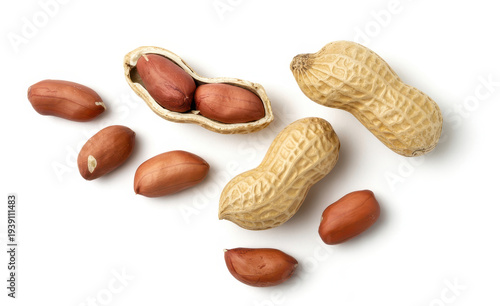 Peanuts and peanut shells on white background brown