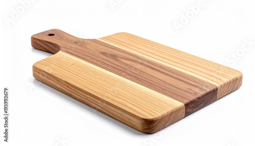 Angled shot of a wooden cutting board with handle against a white backdrop