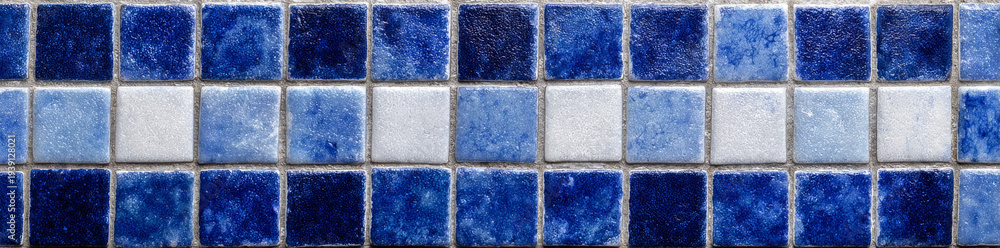 Fototapeta premium Blue and white ceramic mosaic tiles with border seamless pattern create vibrant and textured surface perfect for decorative wall or floor design