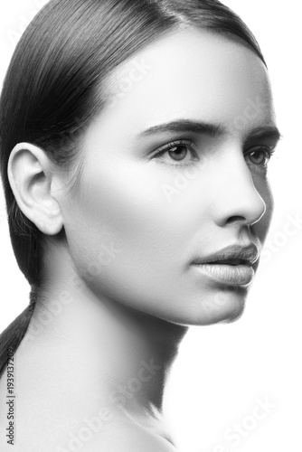 Beauty face of a young woman, clean skin. Monochrome
