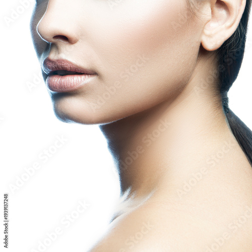 Lips and shoulder of model girl. Nude make-up, perfect skin. Skincare health concept. Monochrome
