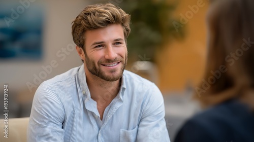 Wallpaper Mural Male therapist and client discussing workplace stress burnout in comfortable counseling office with calming neutral tones, ideal for professional mental health masculine wellness support, and Torontodigital.ca