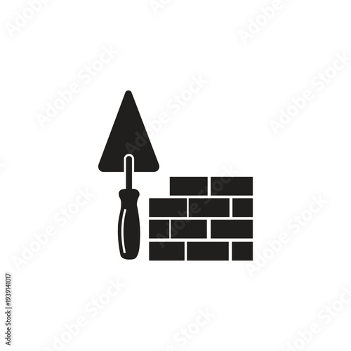 Construction and Building Industry Concept Bricklaying Trowel Tool and Brick Wall Symbol Industrial Development and Urban Planning Construction Site Work Site Foundation Building Materials