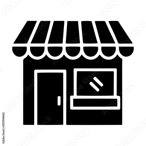 Storefront with awning and display window showcasing products from a retail business location