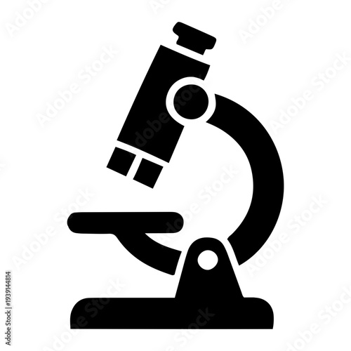 Scientist examining specimen with microscope on laboratory counter from close-up viewpoint