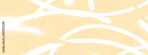 Soft yellow abstract background with white spray paint strokes and speckles