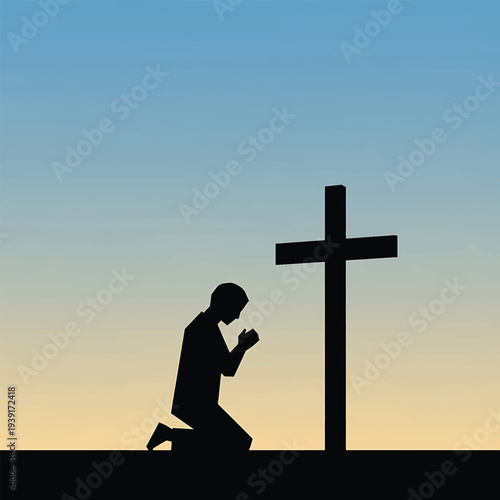 Silhouette of a praying man kneeling before a christian cross