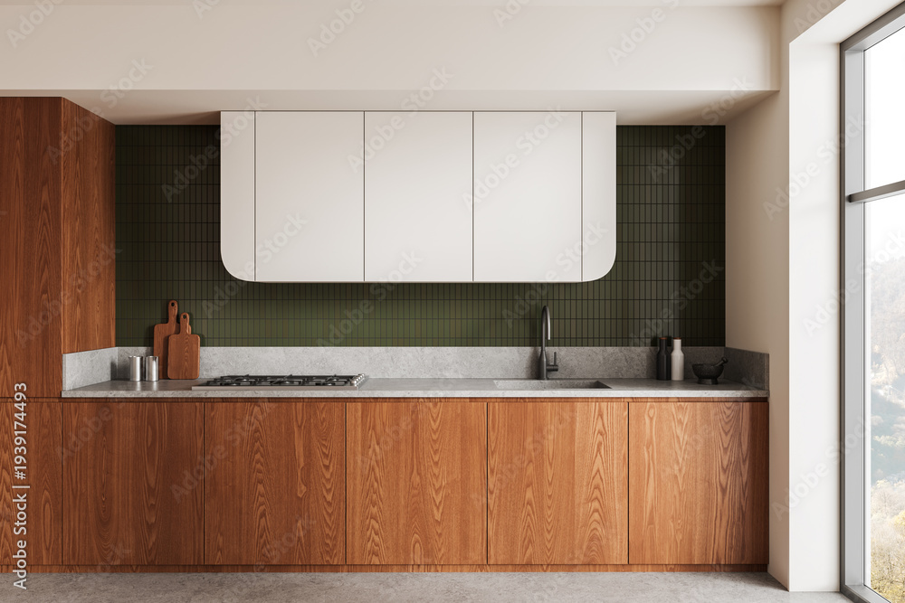 Fototapeta premium Modern kitchen interior with wood cabinetry, white upper units and green tiled backsplash in clean contemporary design.