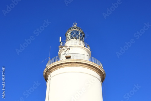 A view of the lighthouse of Malaga. The lighthouse is an iconic 19th-century lighthouse located at the entrance to the Port of Malaga.