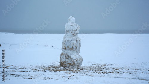 Lonely Snowman Standing in a Quiet Winter Landscape