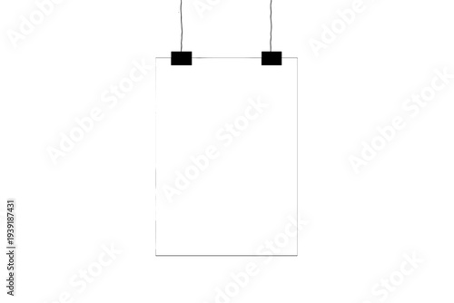 Blank sign hanging on a wall in an empty space with black clips at the