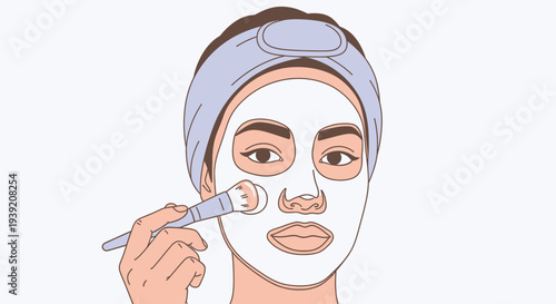 Woman applying facial mask with brush for skincare routine.